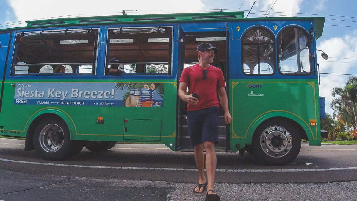 man getting off of the siesta key breeze trolley on Siesta Key , Florida © Joel Hartz