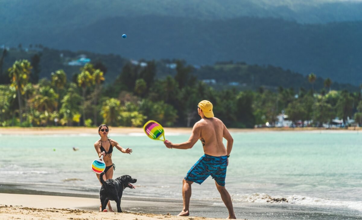 Couple enjoying Luquillo beach with dog