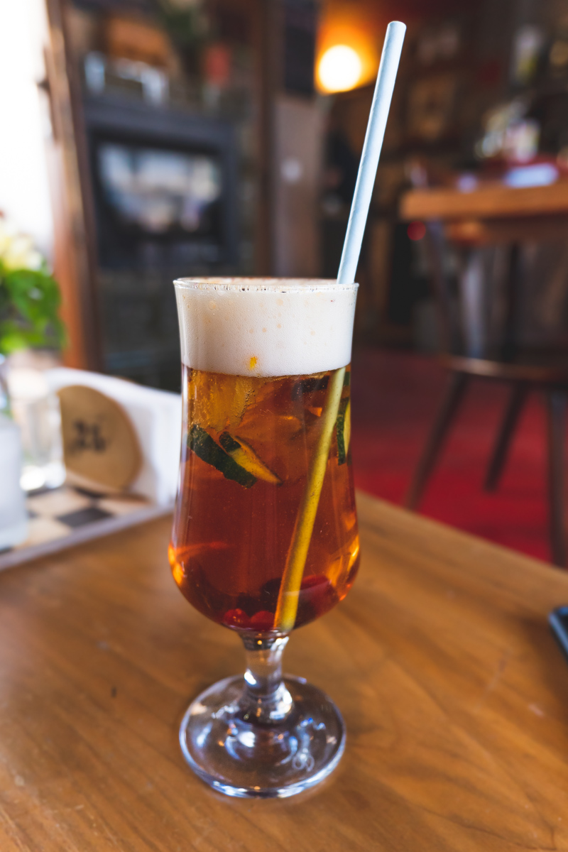Freshly served Pimm's Cup with straw at restaurant