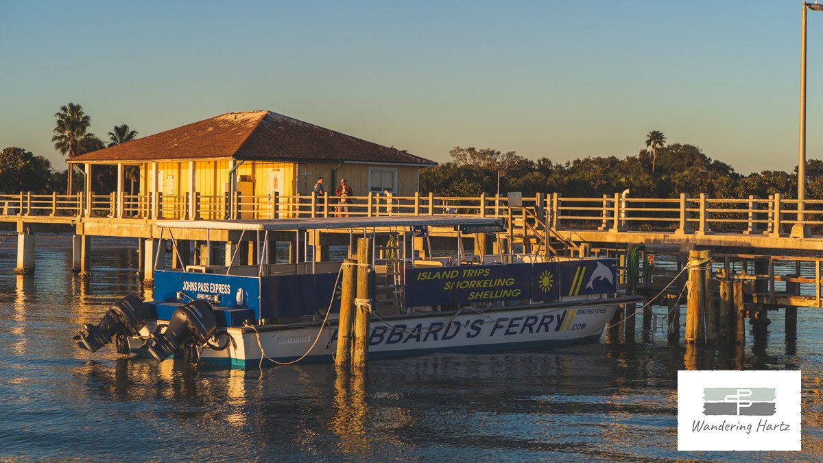 Ferry tied up to the pier at Fort De Soto park at sunset