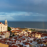 Rainbow ending in Alfama neighborhood of Lisbon Portugal