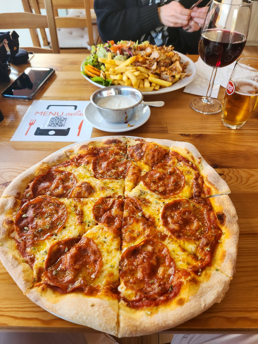 pizza and gyro platter with wine and beer