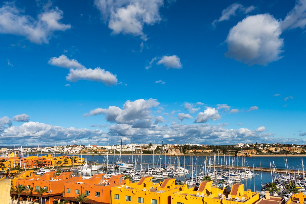 colorful Marina in Portimao against blue sky