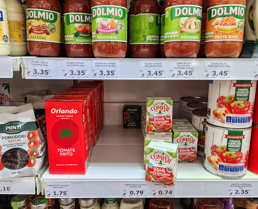 Shelves of pasta sauce and condiments in grocery store in portugal