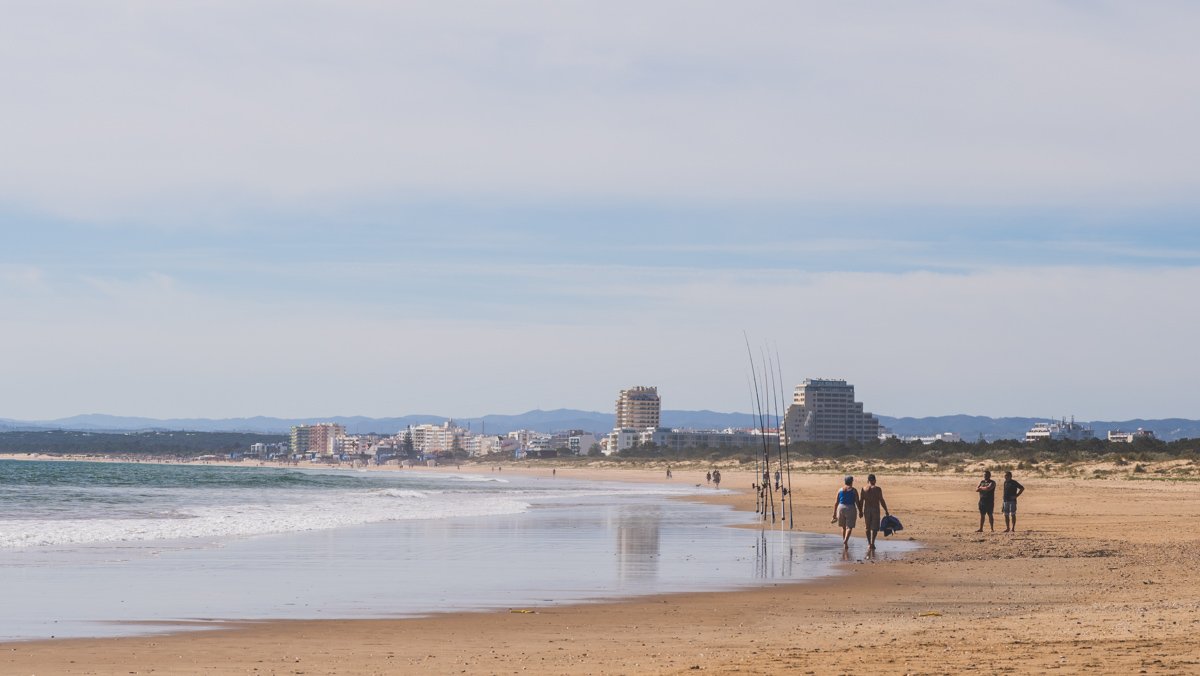 View of people enjoying Praia de Santo António with Monte Gordo in background Vila Real de Santo Antonio © Joel Hartz