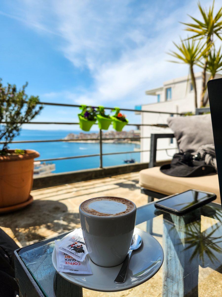 vertical image of cappuccino with a view in saranda albania