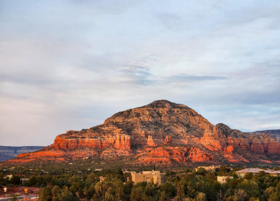 looking out at the red rocks with bathed in light from at sunset from sedona summit hilton vacation club