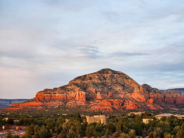 looking out at the red rocks with bathed in light from at sunset from sedona summit hilton vacation club