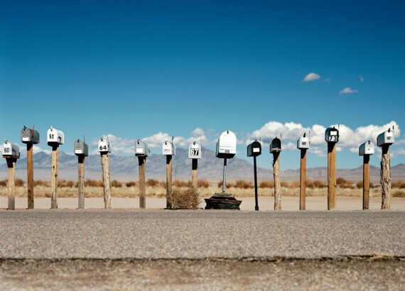 a row of mailboxes in the desert